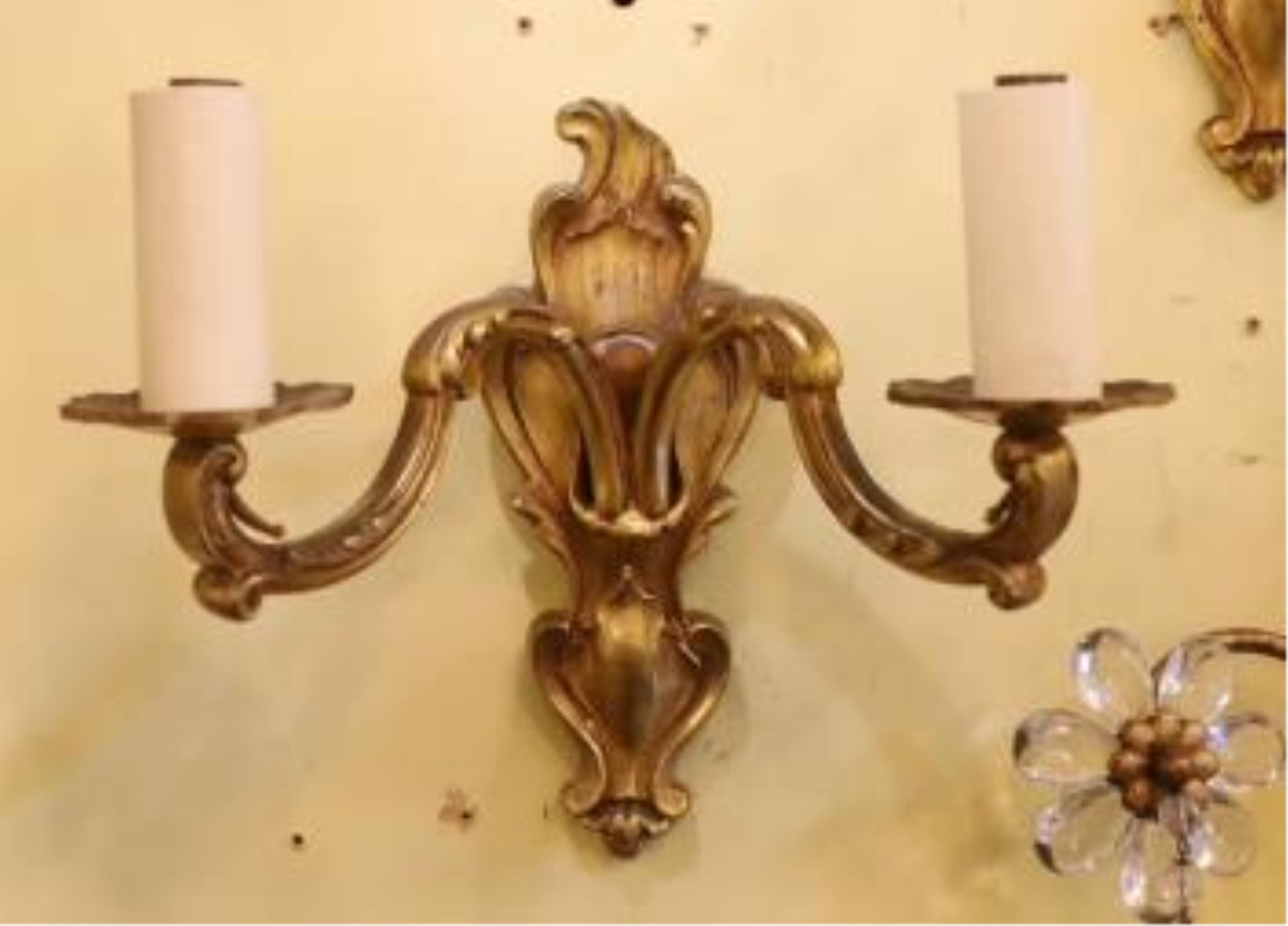 A pair of late 19th century French ormolu twin branch wall lights, 21cm high. Condition - fair to good